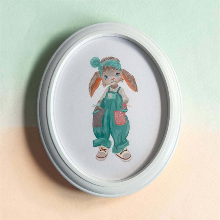 Hand-Painted Bunny Nursery Art, Teal Overalls, Oval Frame (11.3 x 9.3 inches)