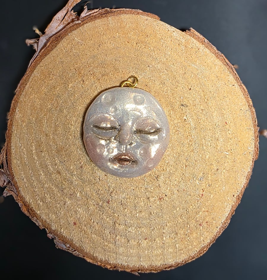 Hand sculpted moon face pendant