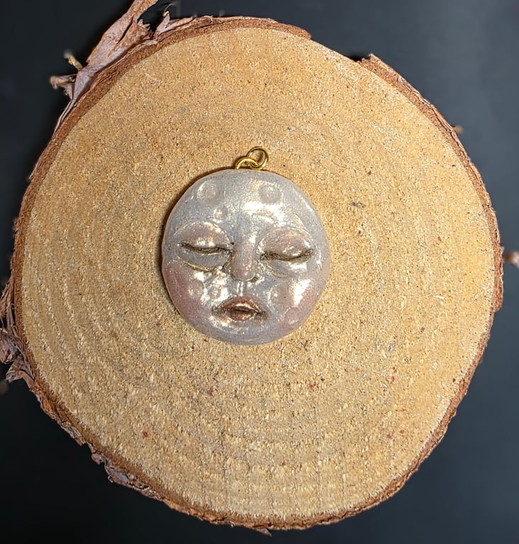 Hand sculpted moon face pendant