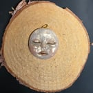 Hand sculpted moon face pendant