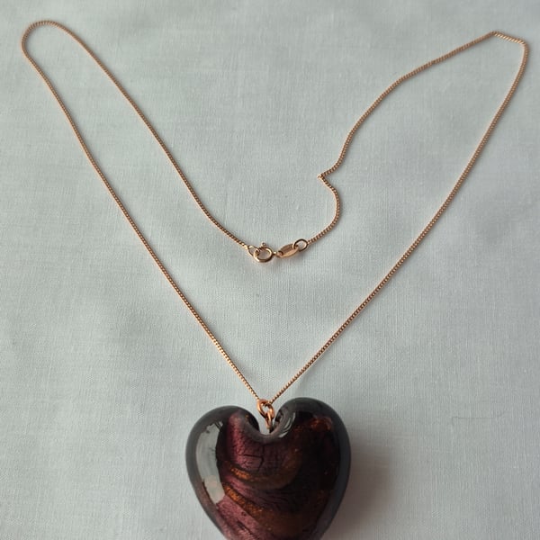 Large glass heart pendant in dark gold on an 18ins rose gold chain