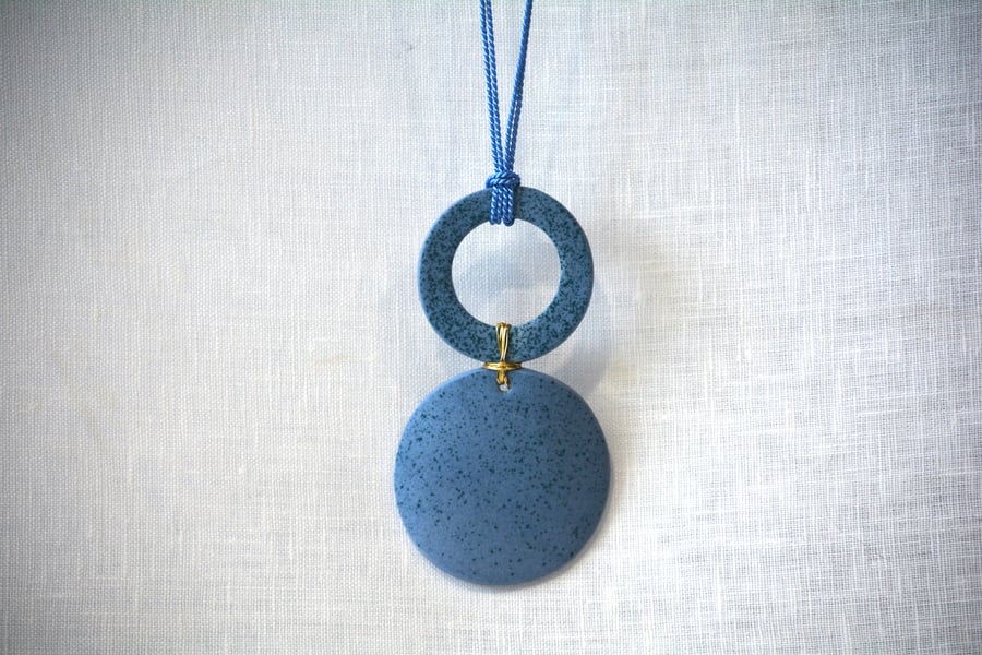 Blue porcelain pendant with green speckled design