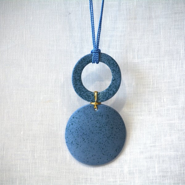 Blue porcelain pendant with green speckled design