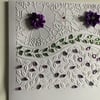 A large, embossed floral card suitable for any occasion.