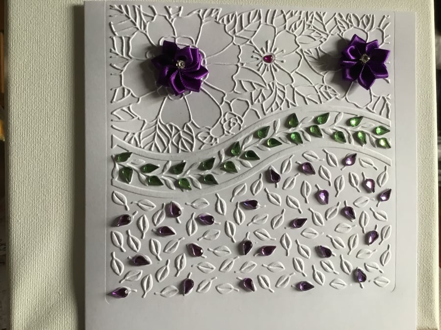 A large, embossed floral card suitable for any occasion.