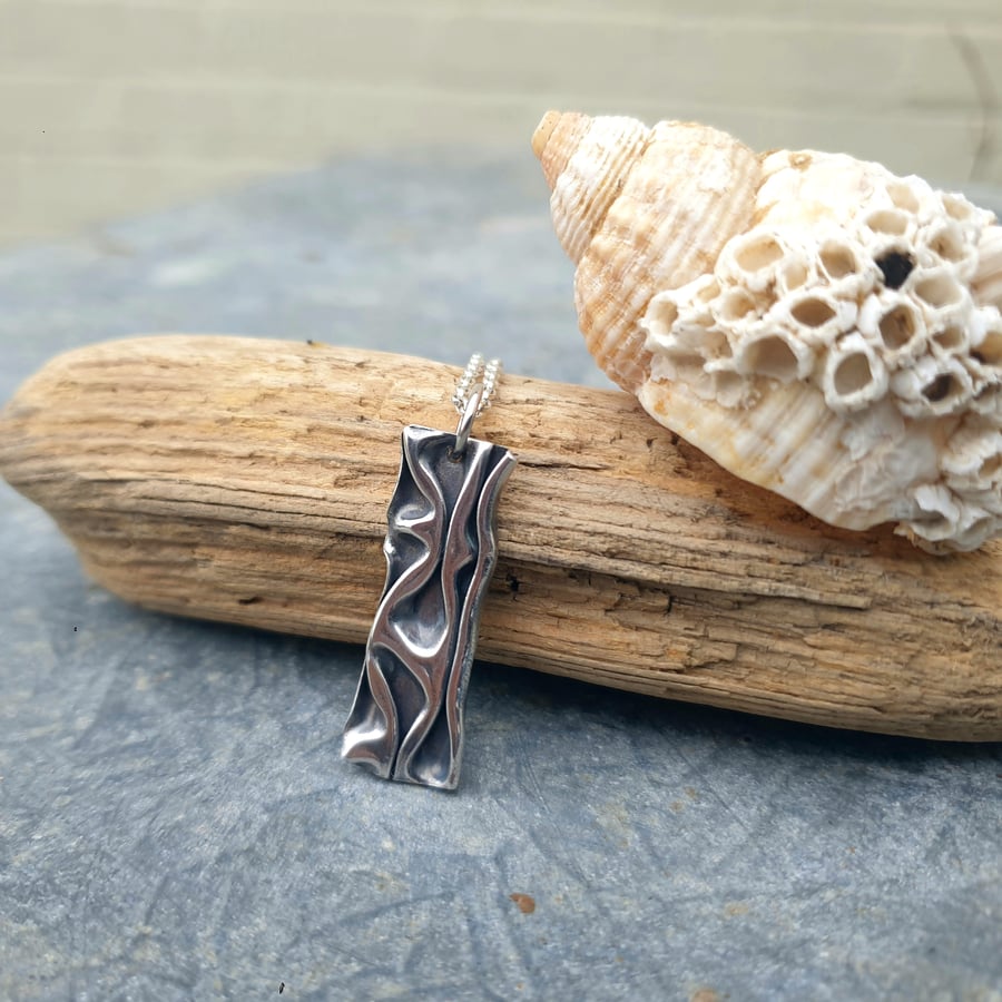 Folded texture fine silver pendant