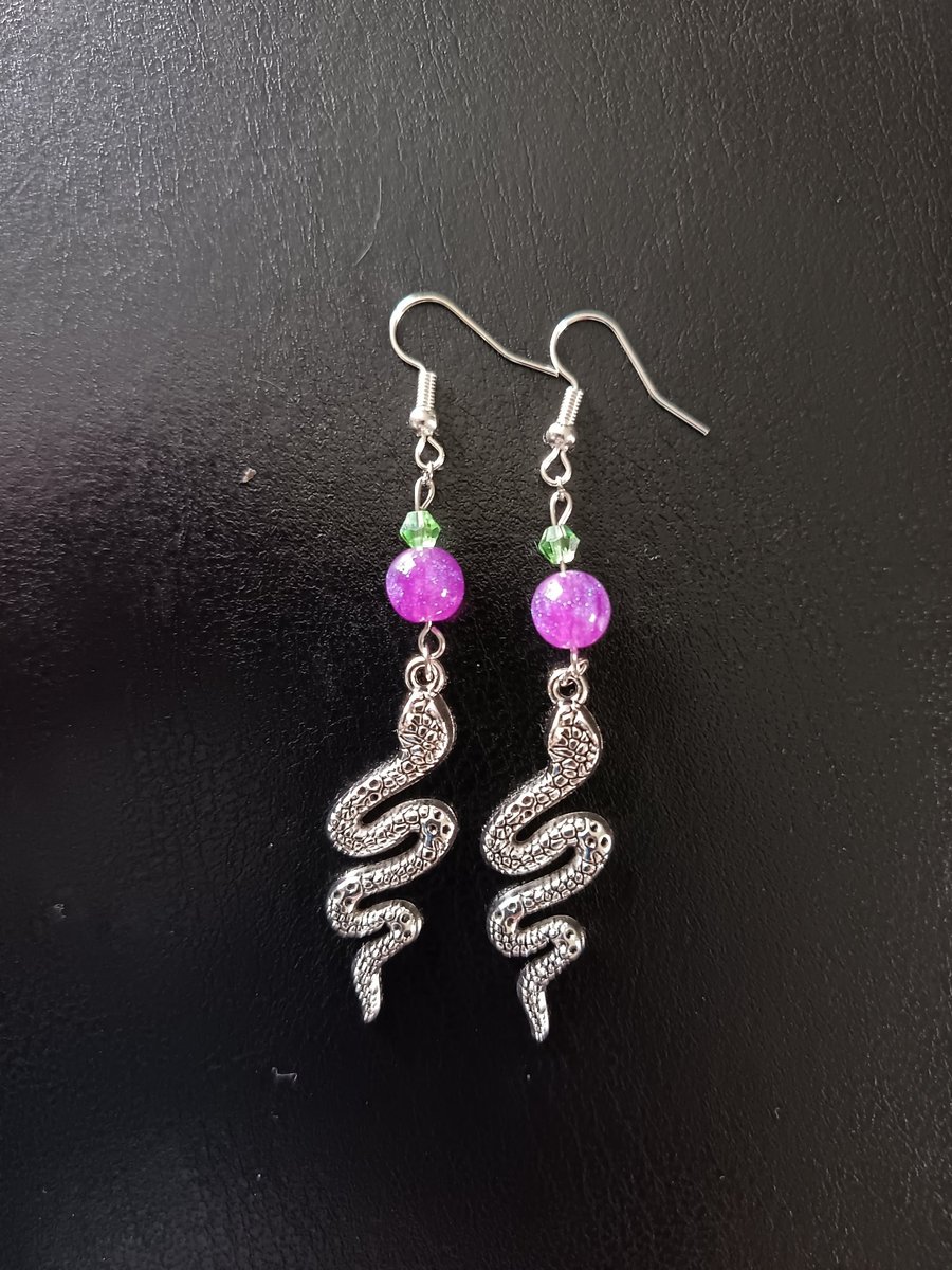 Silver snake charm dangle earrings with green and purple beads