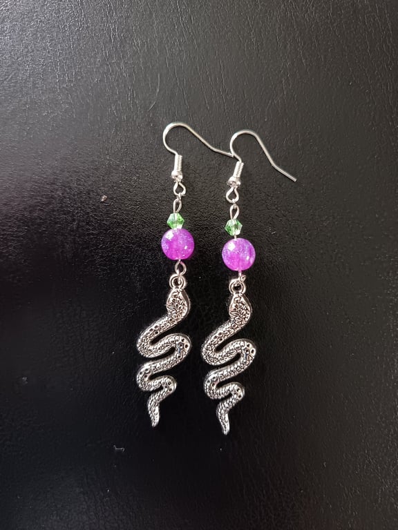 Silver snake charm dangle earrings with green and purple beads