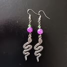 Silver snake charm dangle earrings with green and purple beads