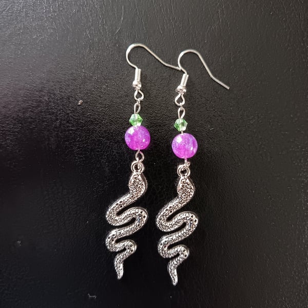 Silver snake charm dangle earrings with green and purple beads