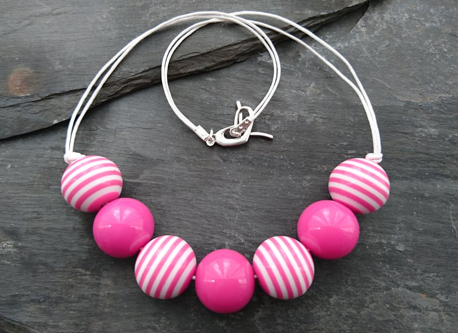 Pink and white striped round acrylic bead necklace, heart shaped clasp