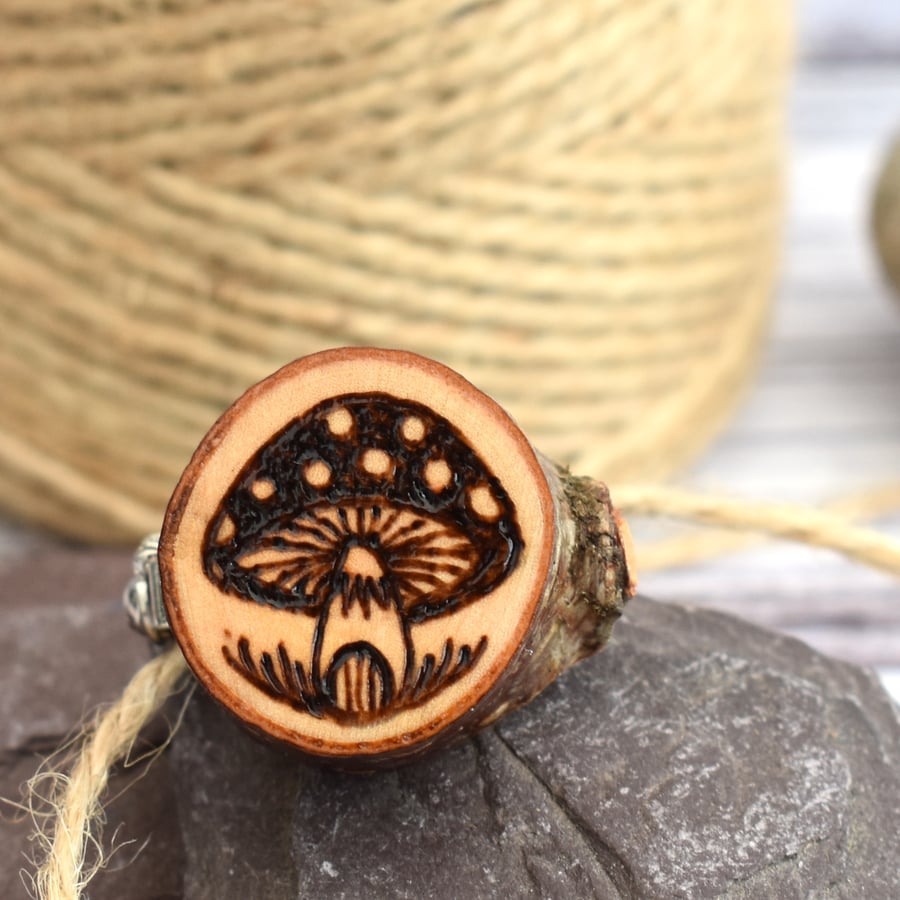 Tiny toadstool brooch hand burned using pyrography.