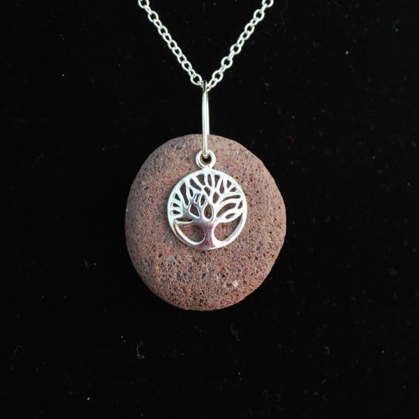 Beach pebble with tree of life charm