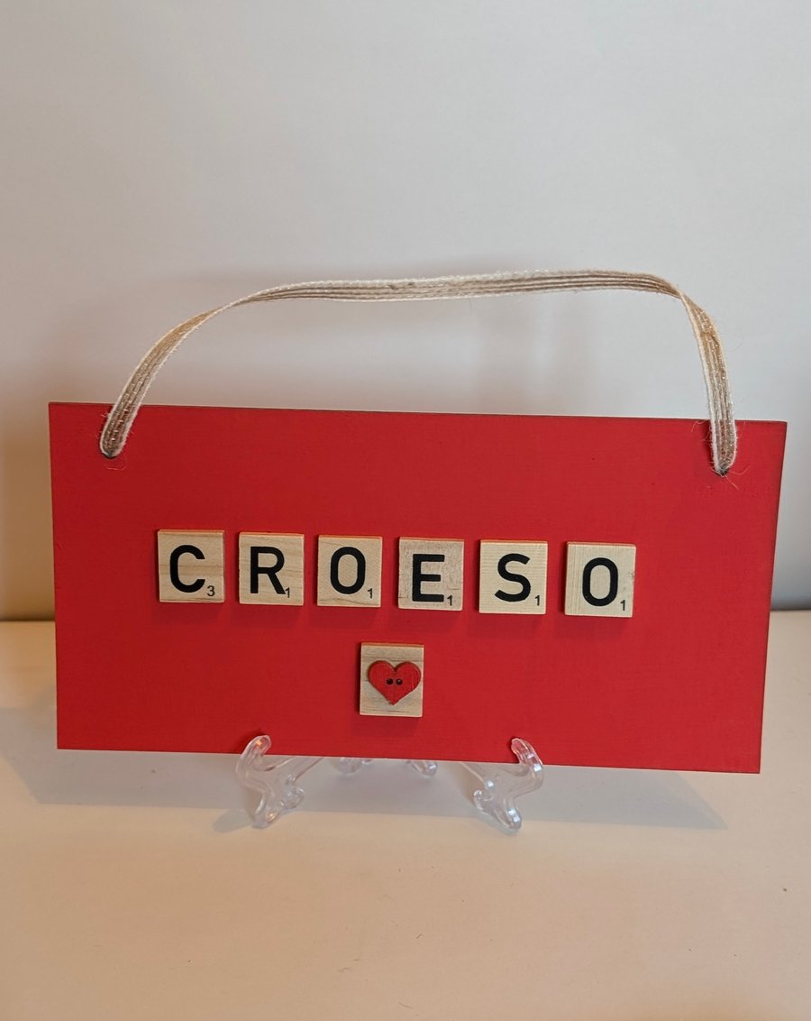 Wooden sign with scrabble tiles spelling Croeso - Welcome
