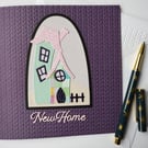 New Home Card - whimsical house with on a purple knitted effect embossed card