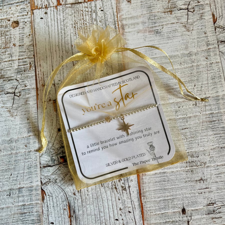 Star Stretch Beaded Bracelet with gold plated charm, gift card and bag