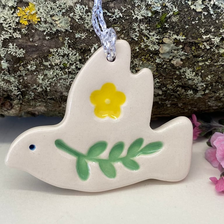 Teeny ceramic dove decoration with leaves and yellow flower