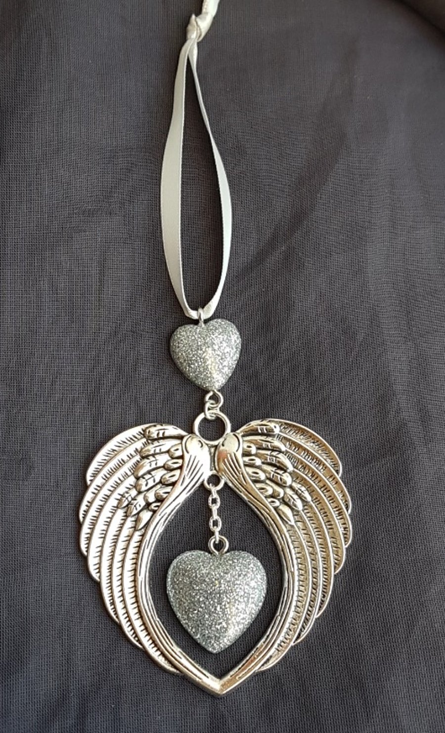 Gorgeous Angel Wings Ornament with Glittery Silver Hearts.
