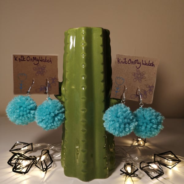 Small turquoise pom pom earrings