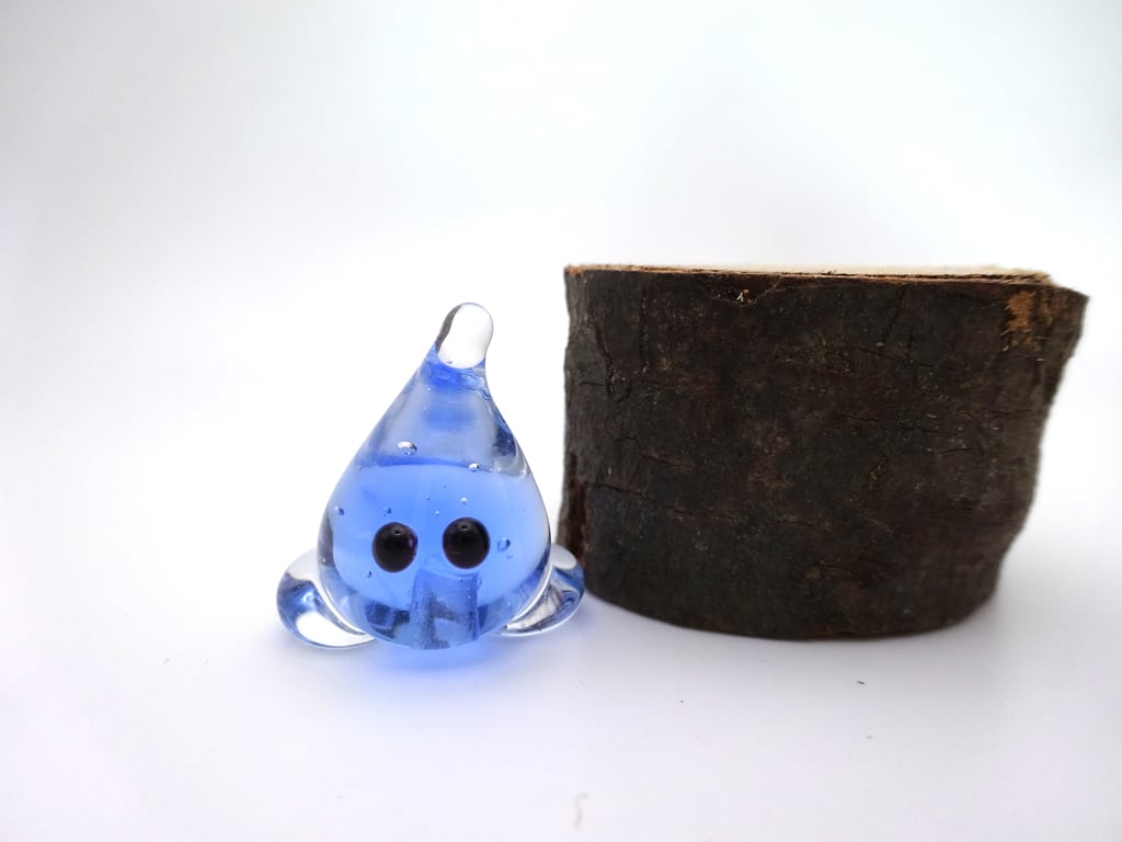 small glass wisp figure