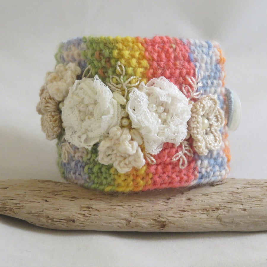 Lace flowers on a rainbow background cuff