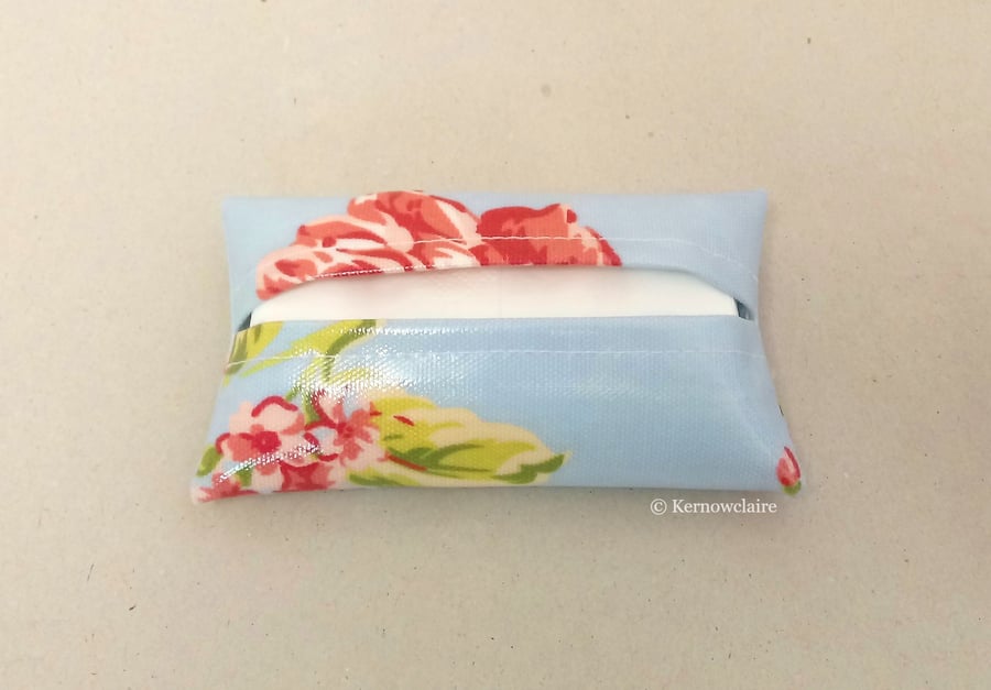 Tissue holder in blue with pink flowers, tissues included.