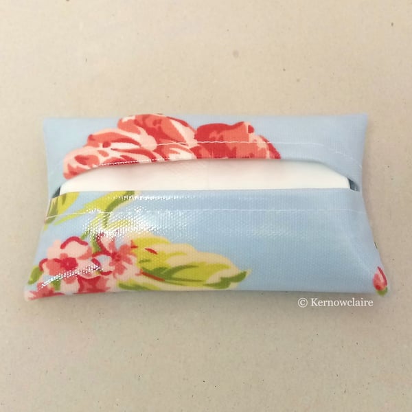 Tissue holder in blue with pink flowers, tissues included.