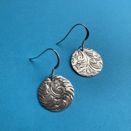 Silver disc earrings made from an antique cigarette case