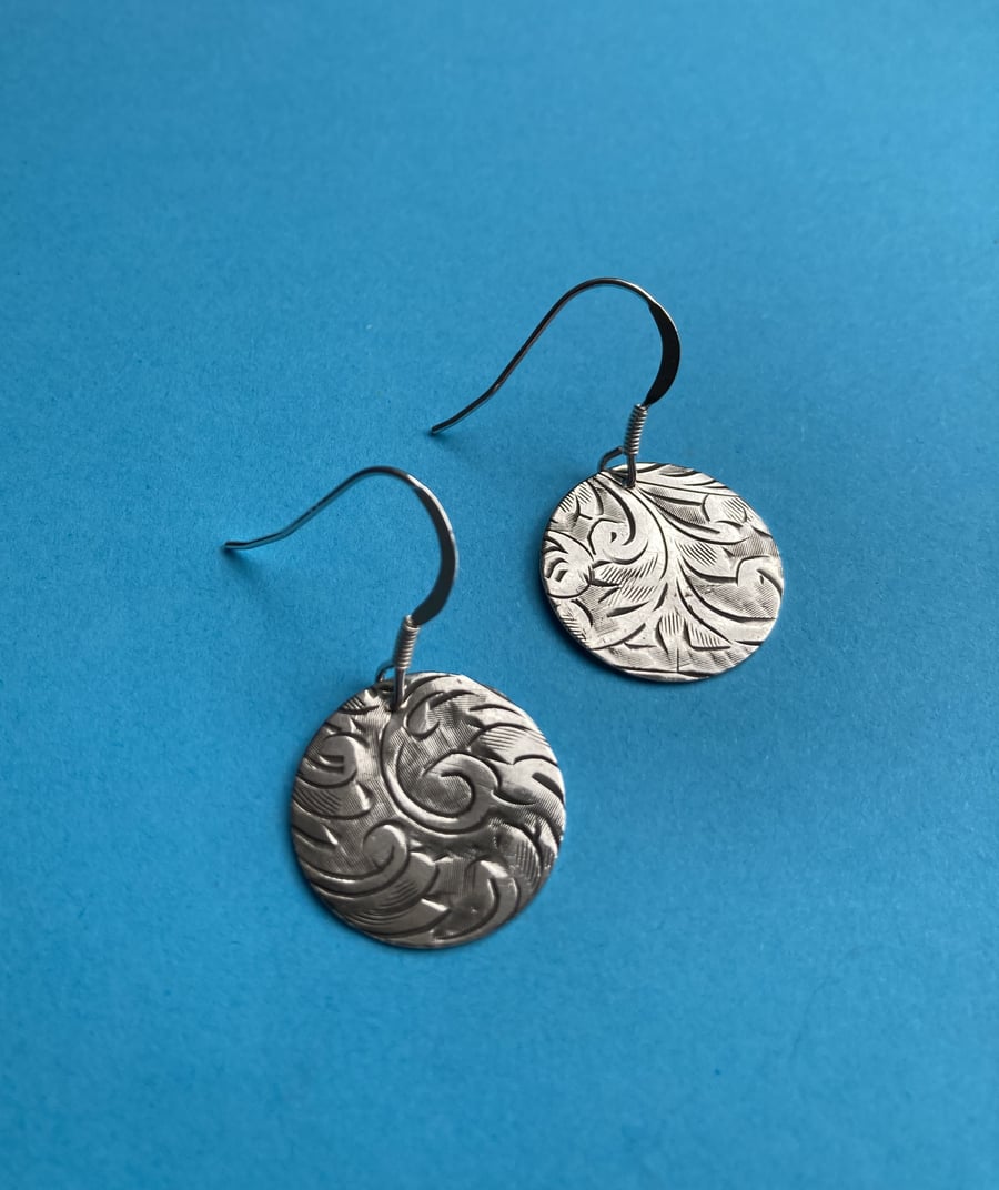Silver disc earrings made from an antique cigarette case