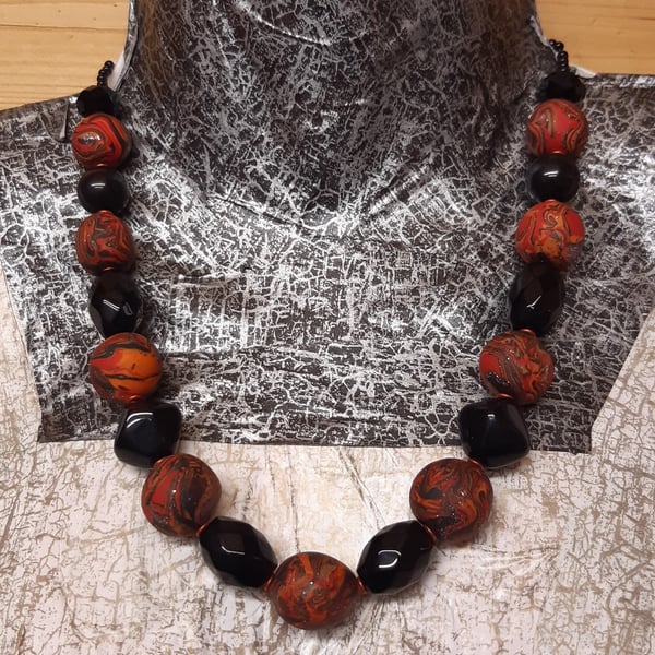 Necklace in  orange, red and black sparkle 