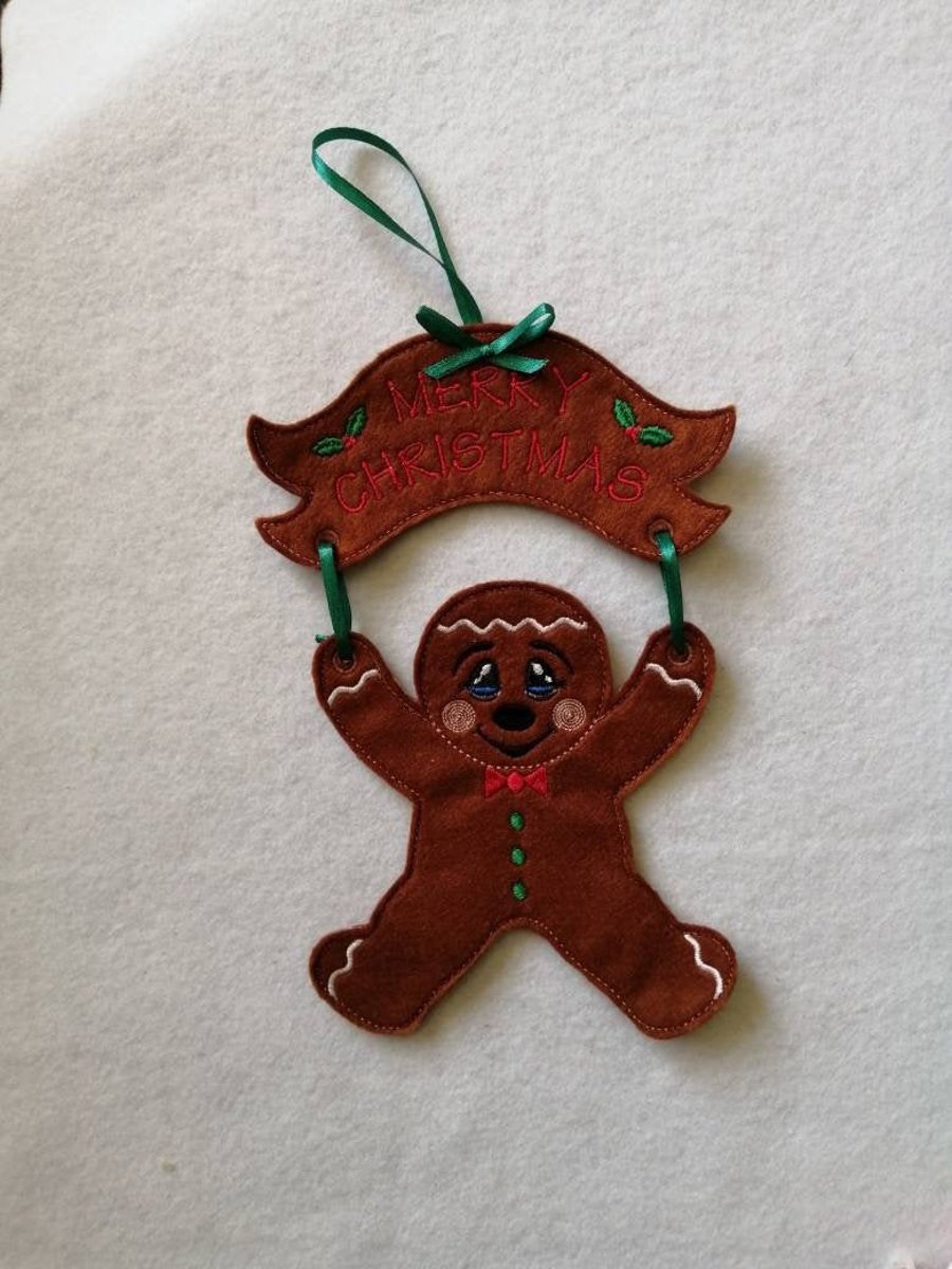 749. Merry Christmas gingerbread man with banner.