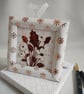 A Winter Bouquet Keepsake Card in tones of Rose Gold, Copper and Pearl White 