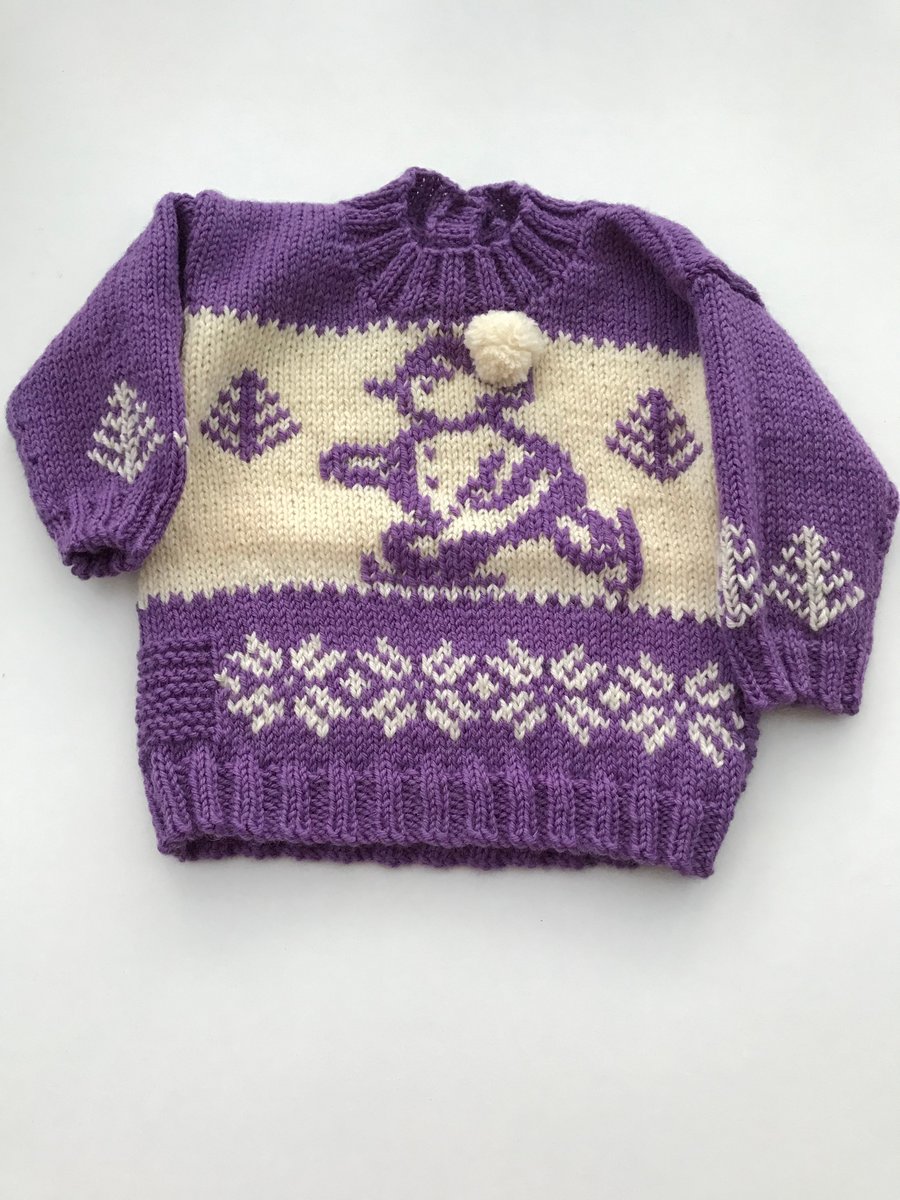 Hand knitted baby jumper with snowman design