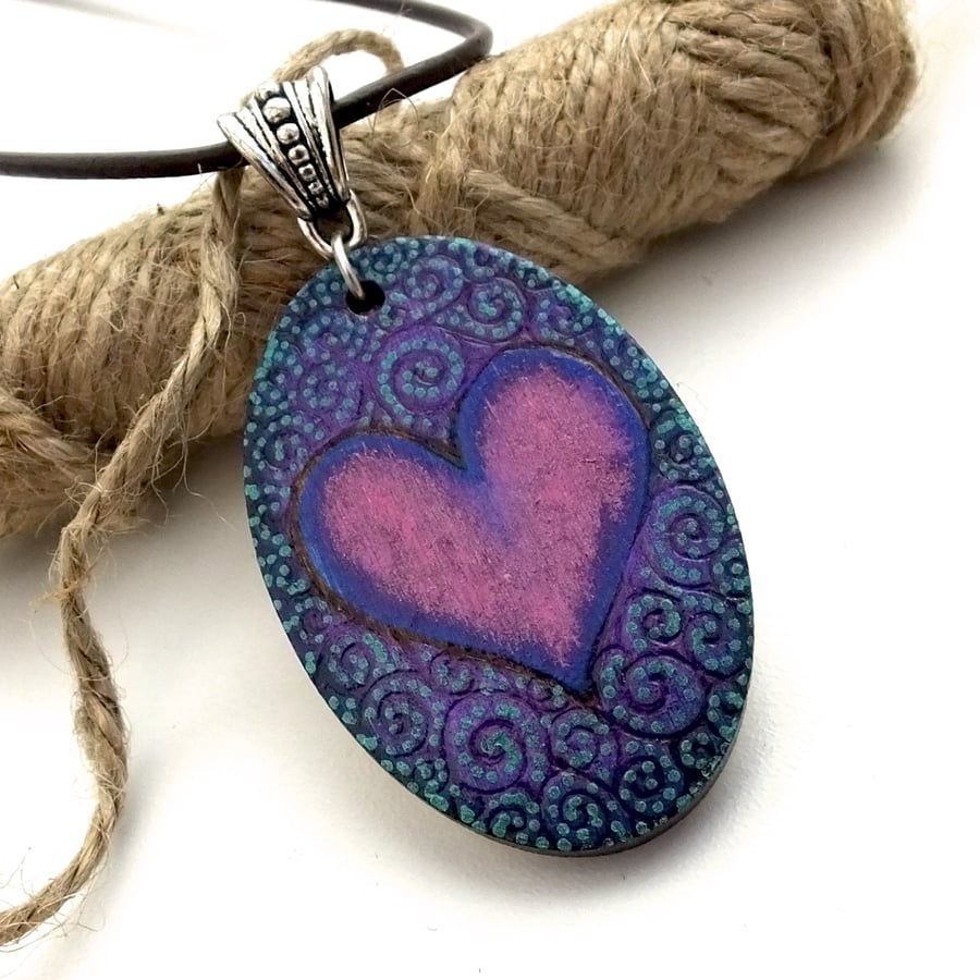 Swirled pyrography heart oval wooden pendant necklace. Hand painted and burned. 