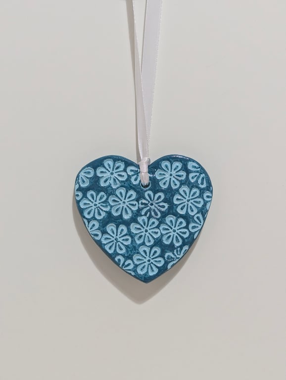Teal clay heart hanging decoration embossed with flowers