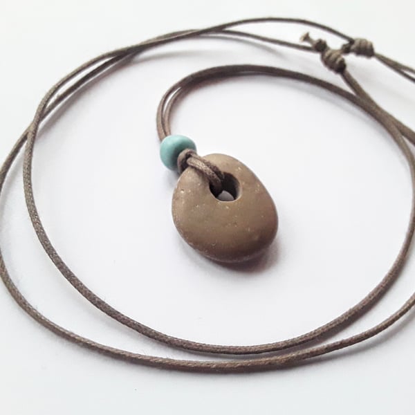 Beautifully Simple Long Pebble Pendant with Turquoise Bead