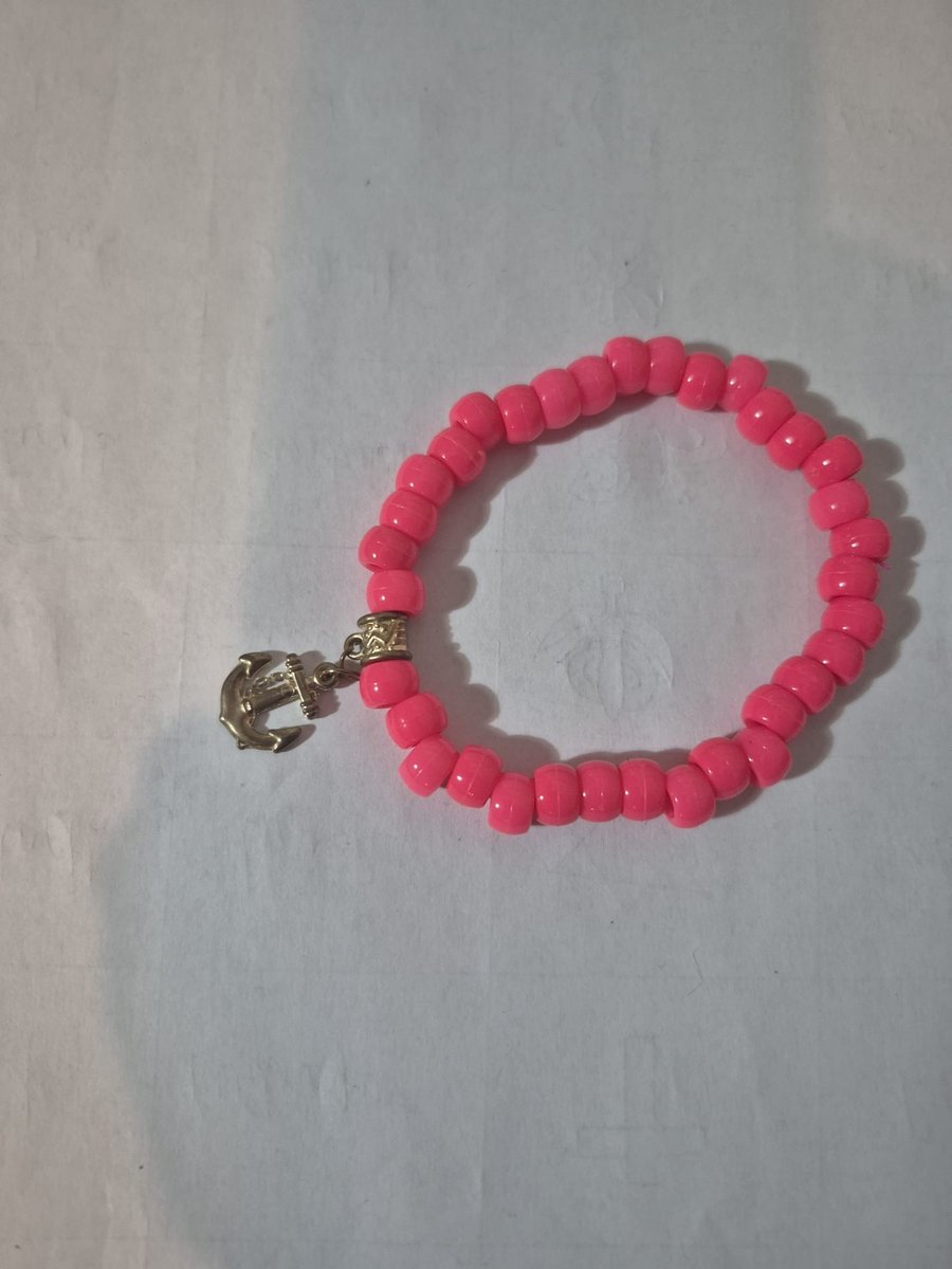 Pink bead bracelet with gold anchor