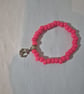Pink bead bracelet with gold anchor