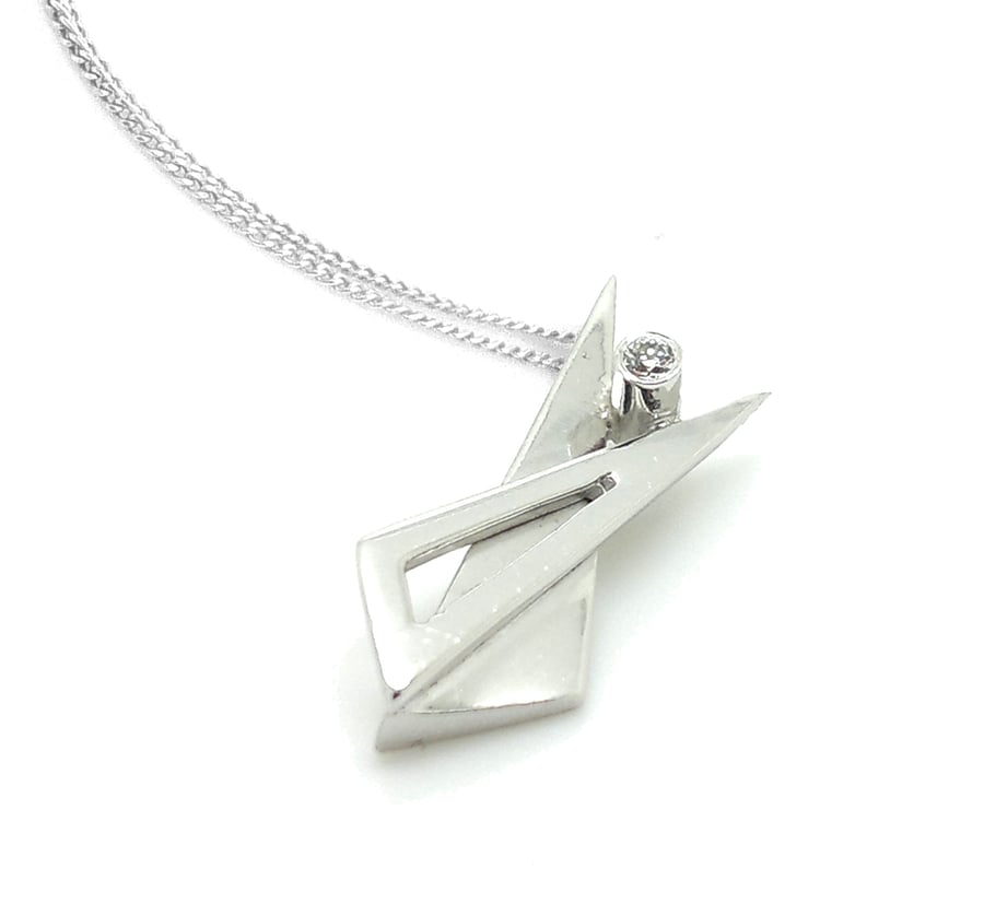 Sterling silver triangle pendant set with CZ