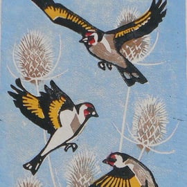 Goldfinches in flight linocut print