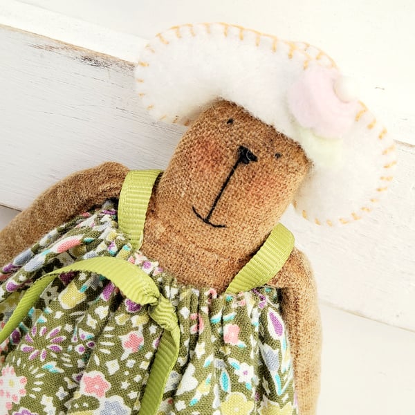 Primitive handmade cloth bear named Beryl on a bobbin