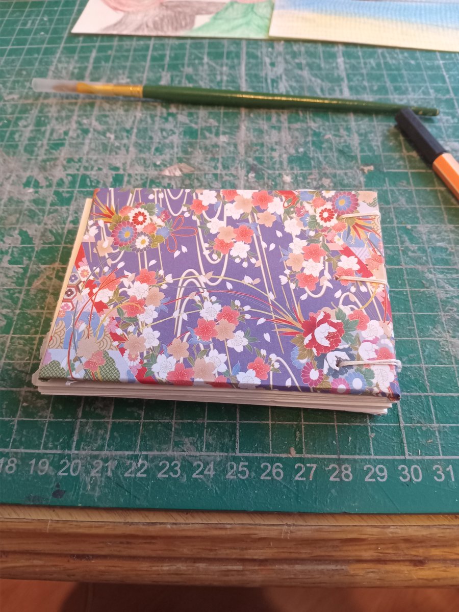 A7 mini sketchbook with budget watercolour paper coptic binding 