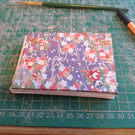 A7 mini sketchbook with budget watercolour paper coptic binding 