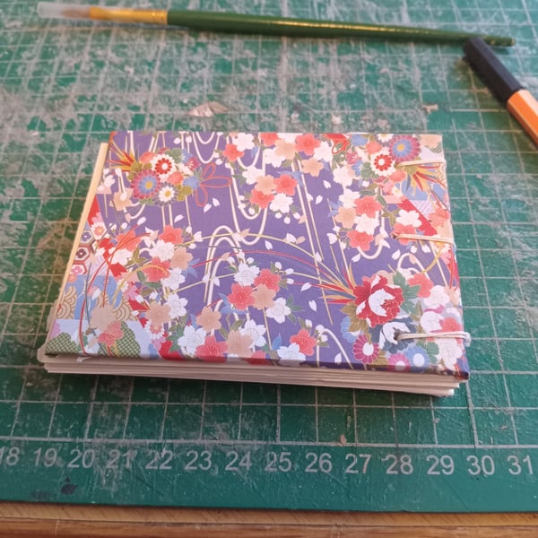 A7 mini sketchbook with budget watercolour paper coptic binding 