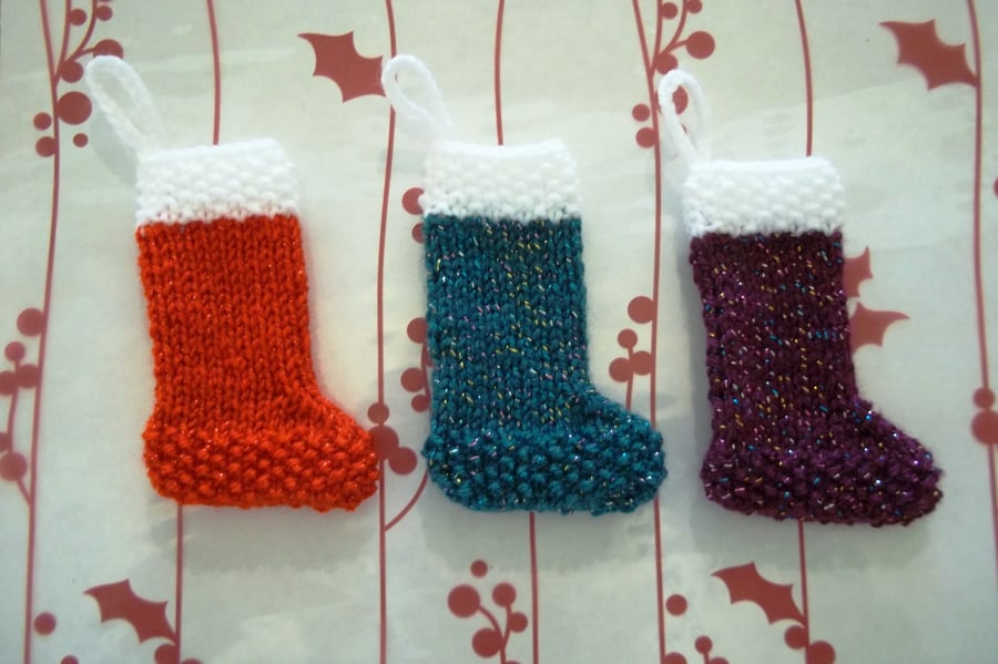 Set of three knitted Christmas mini stockings. 