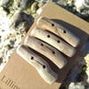 Four chunky driftwood toggle buttons