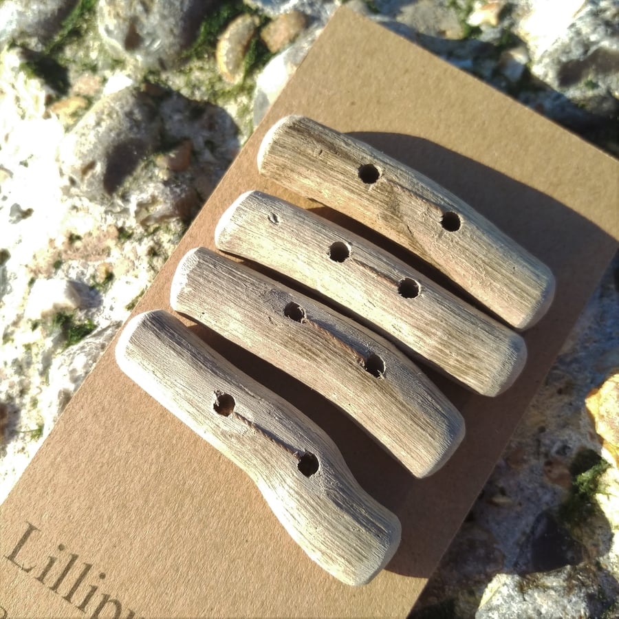 Four chunky driftwood toggle buttons
