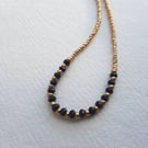 Onyx and gold glass beaded necklace, 16 to 18 inches