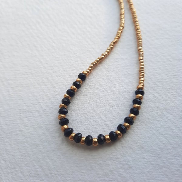 Onyx and gold glass beaded necklace, 16 to 18 inches
