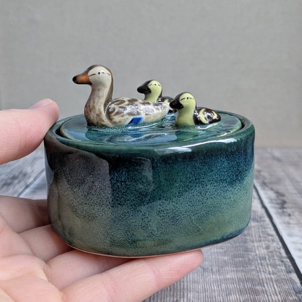 Small ceramic lidded pot with duck and two ducklings